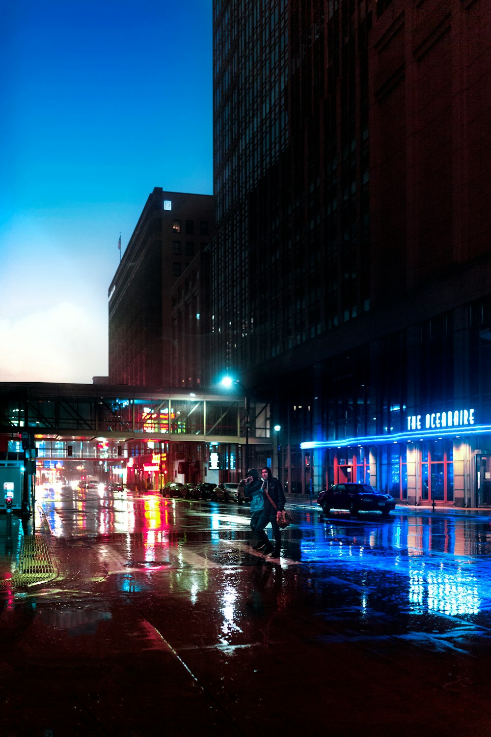 cars on road near buildings during night time