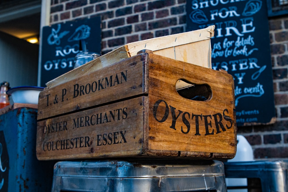 a stack of wooden crates sitting next to a brick building