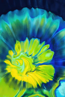 A vibrant abstract print with swirling blues and golds, capturing a sense of movement and depth.