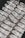 Stacks of shiny silver bars are neatly arranged, each bar featuring engravings and distinctive markings.