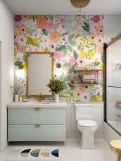 a bathroom with a floral wallpaper and a white toilet