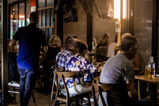 Cozy restaurant seating area with ambient lighting and drinks.