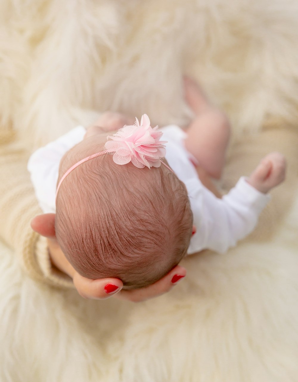 a baby is laying down on a fluffy blanket