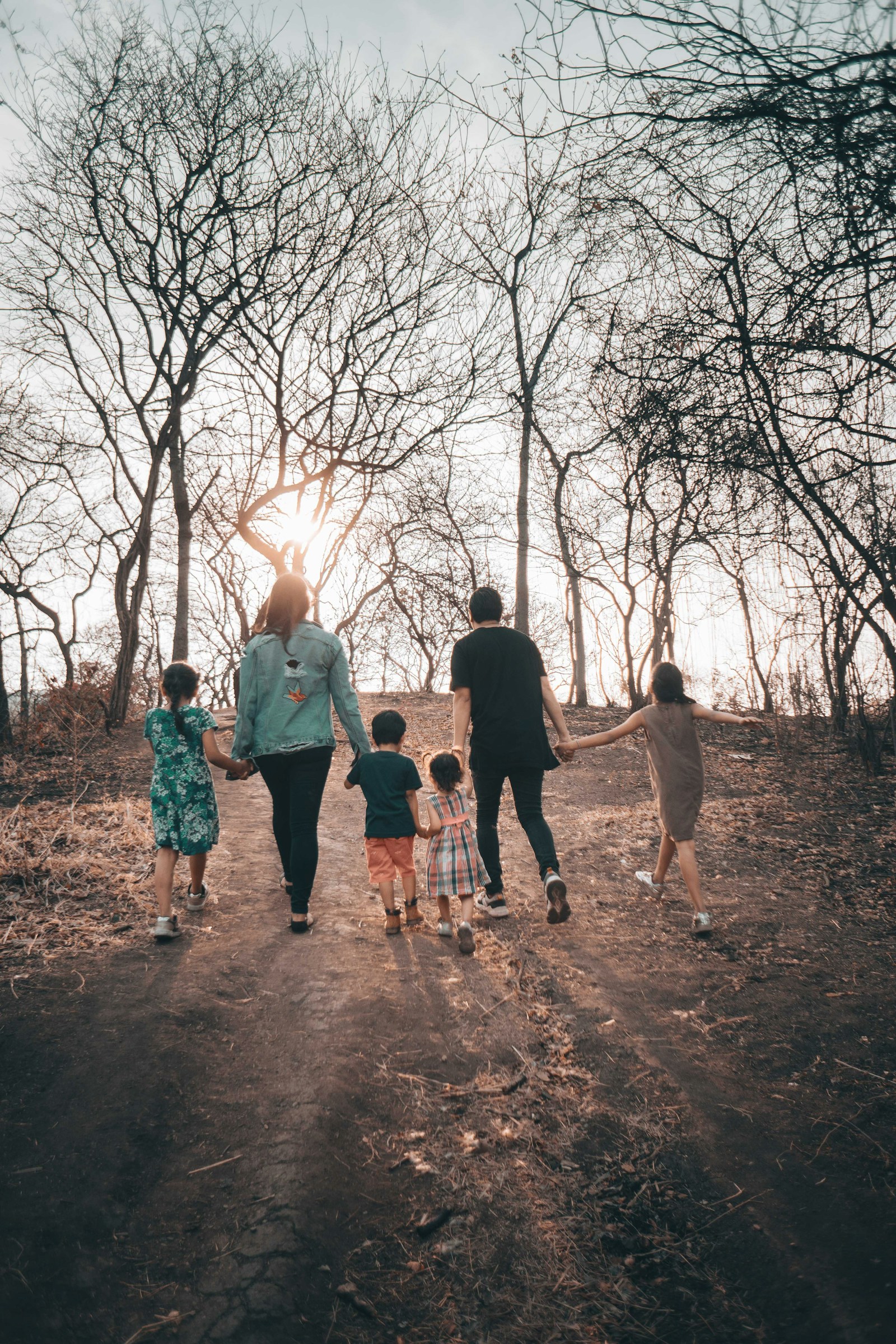 Family walking in green space in Lawson Heights Saskatoon