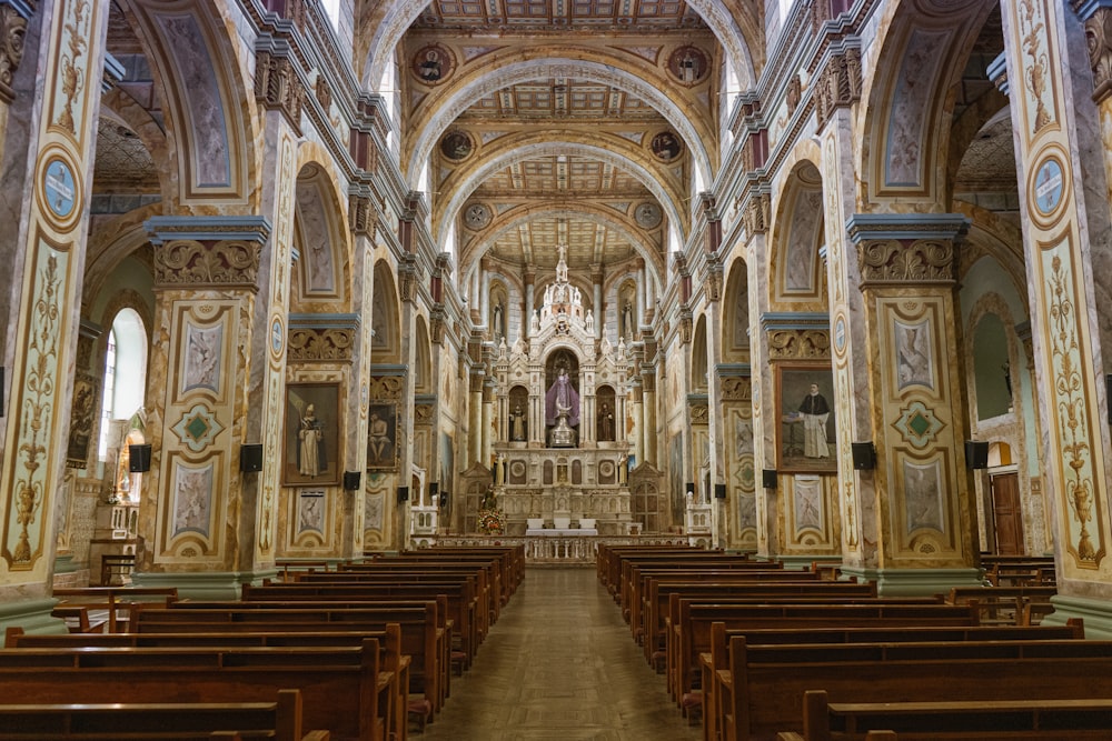 brown wooden bench inside cathedral