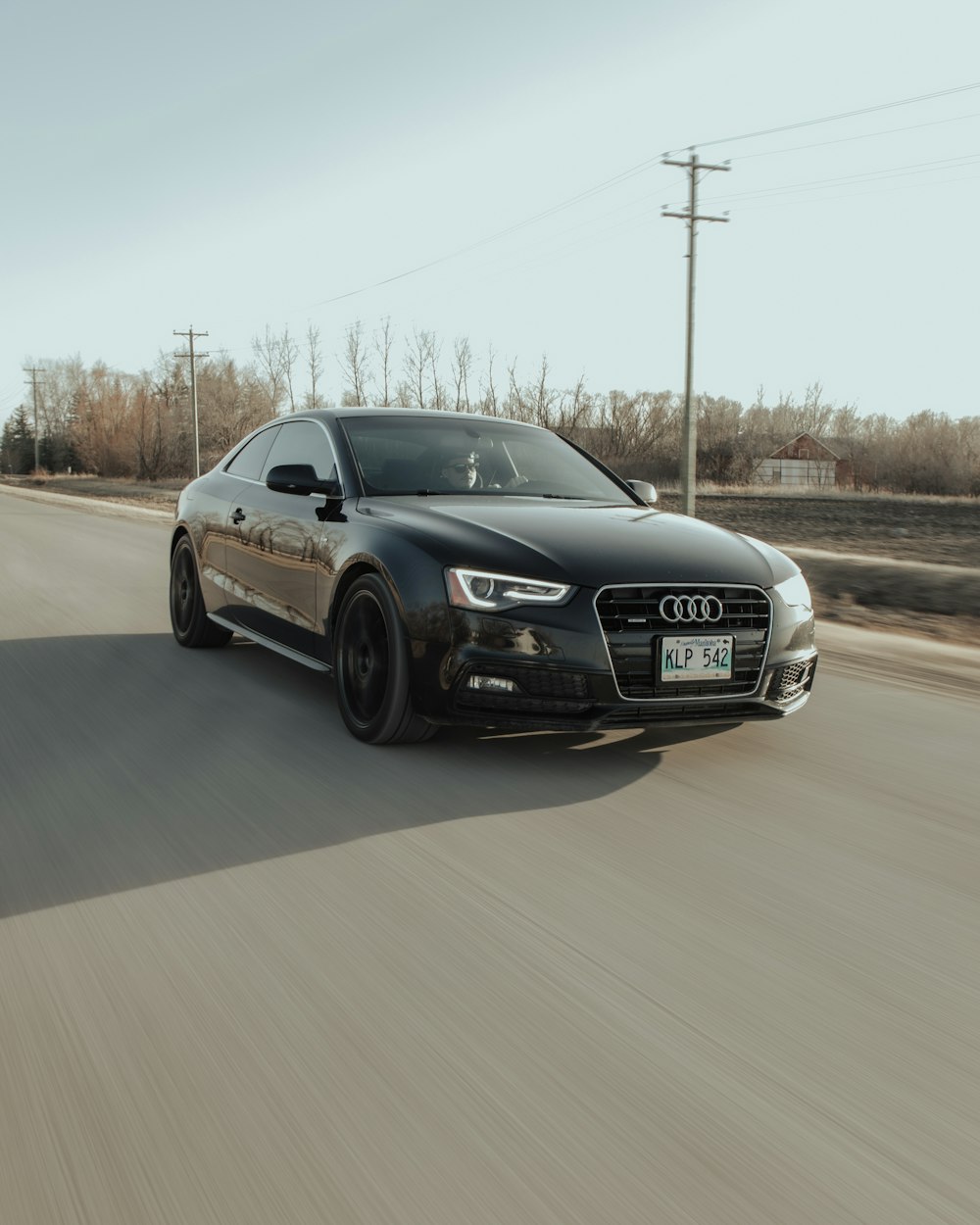 black audi coupe on road during daytime