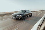 black audi sedan on road during daytime