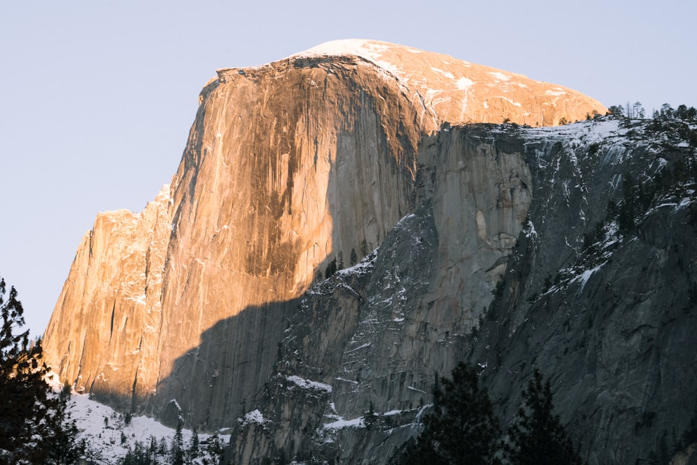 brown rocky mountain under blue sky during daytime