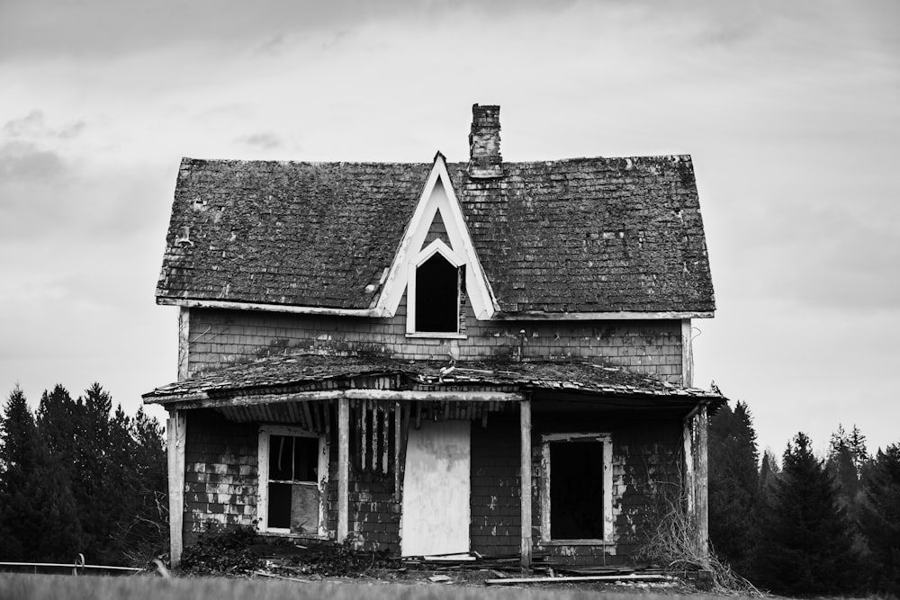 grayscale photo of wooden house