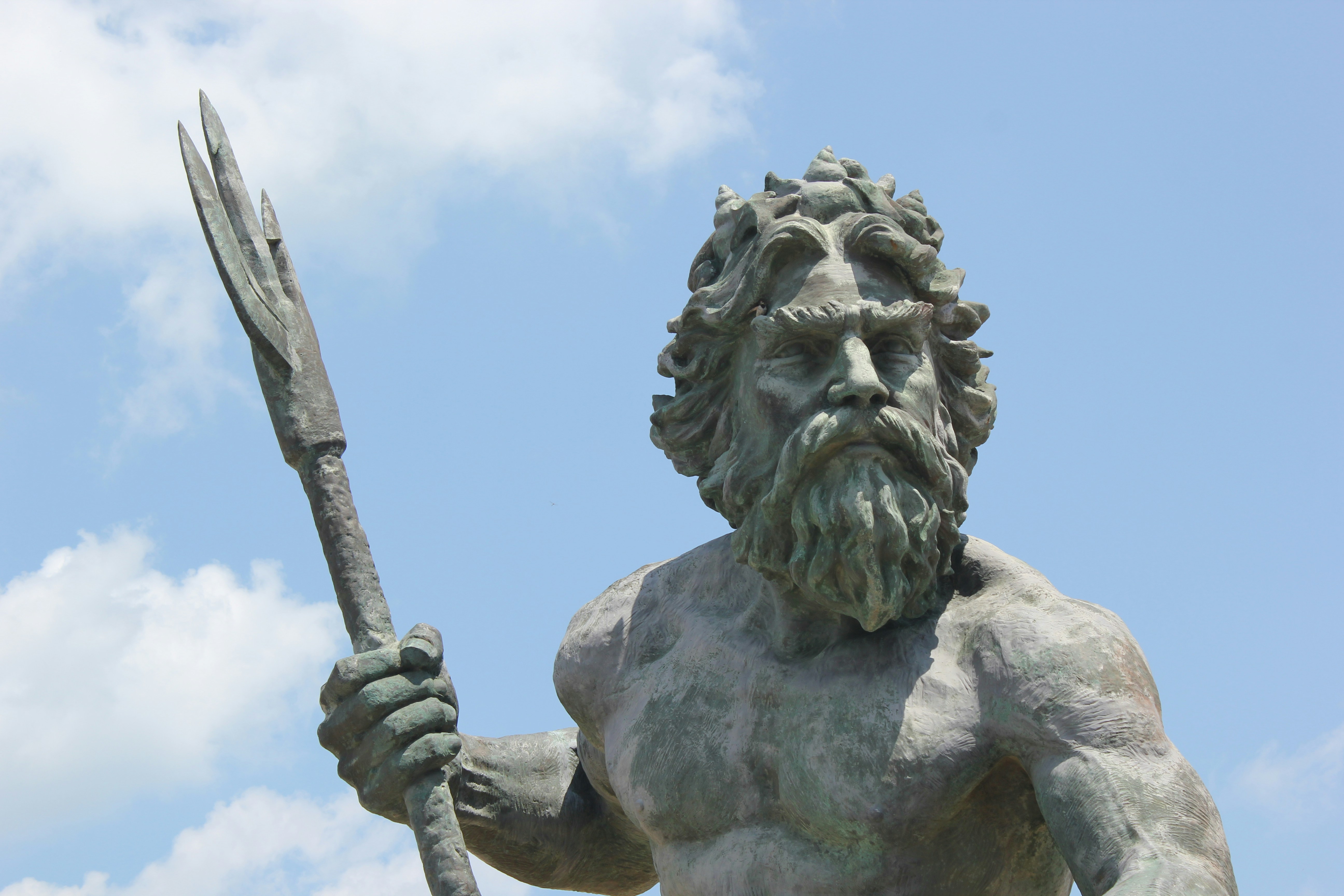 gray concrete statue under blue sky during daytime