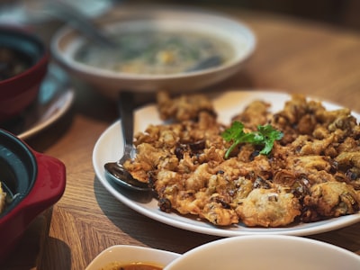 fried chicken on white ceramic plate stuffing zoom background