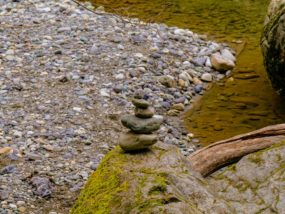 gray stone on river during daytime