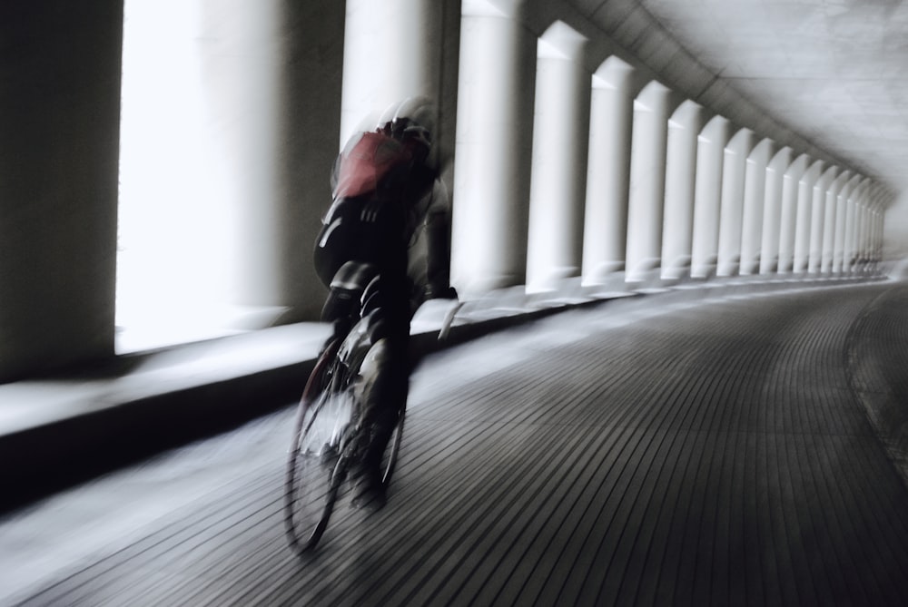 man in black jacket riding bicycle