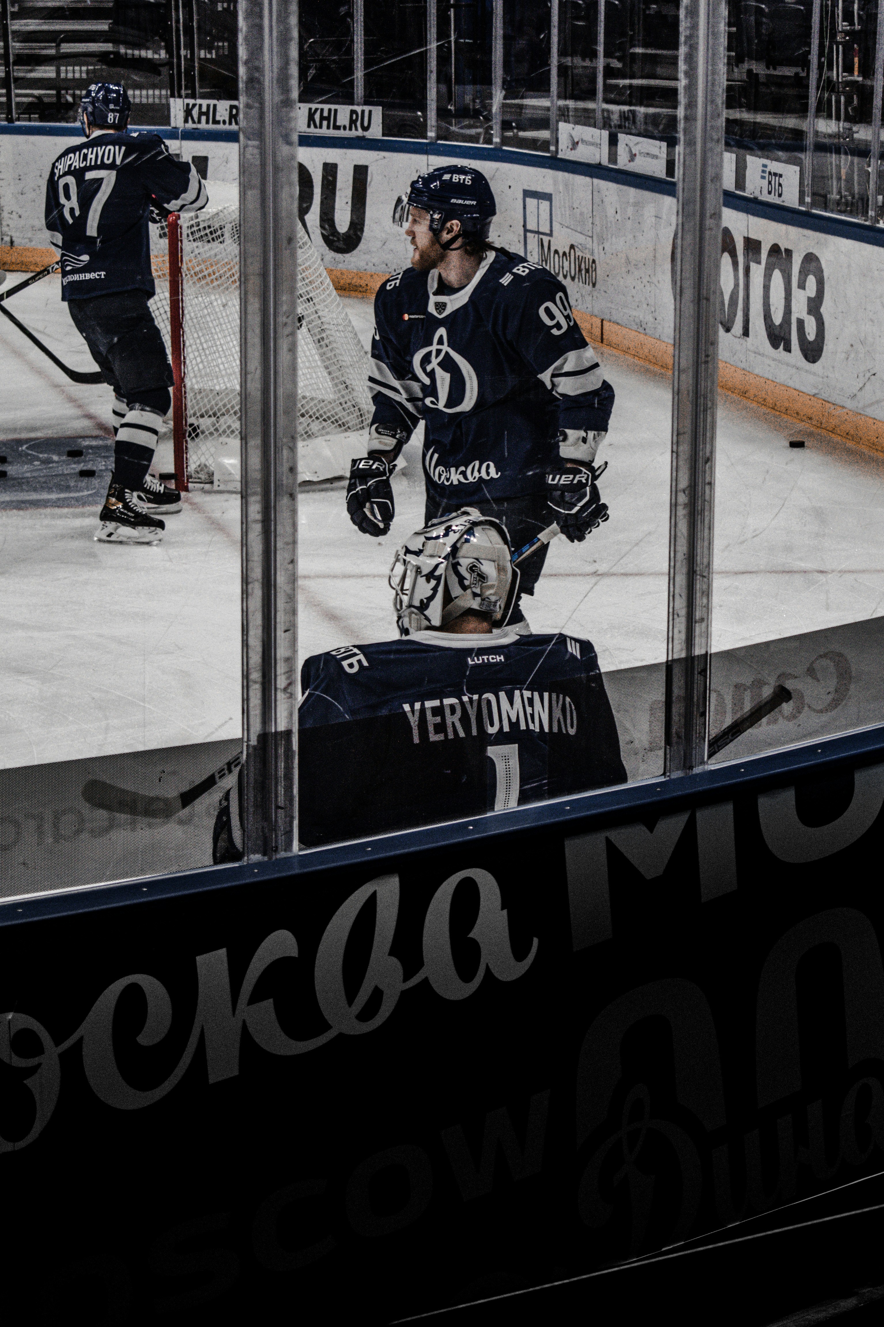 2 men playing ice hockey