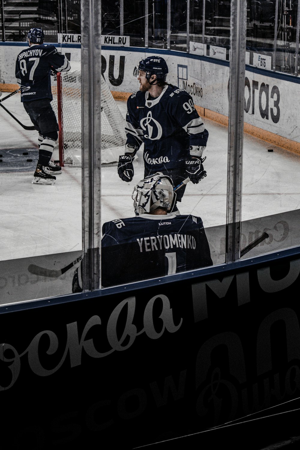 2 men playing ice hockey