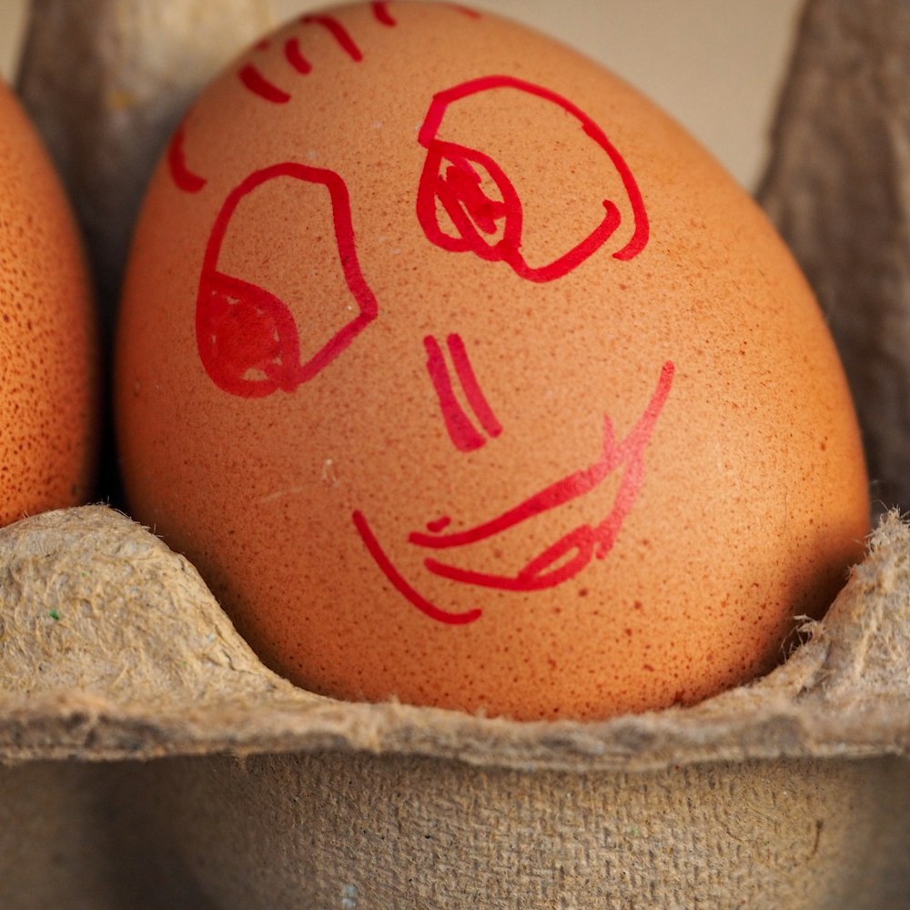 brown egg on white textile