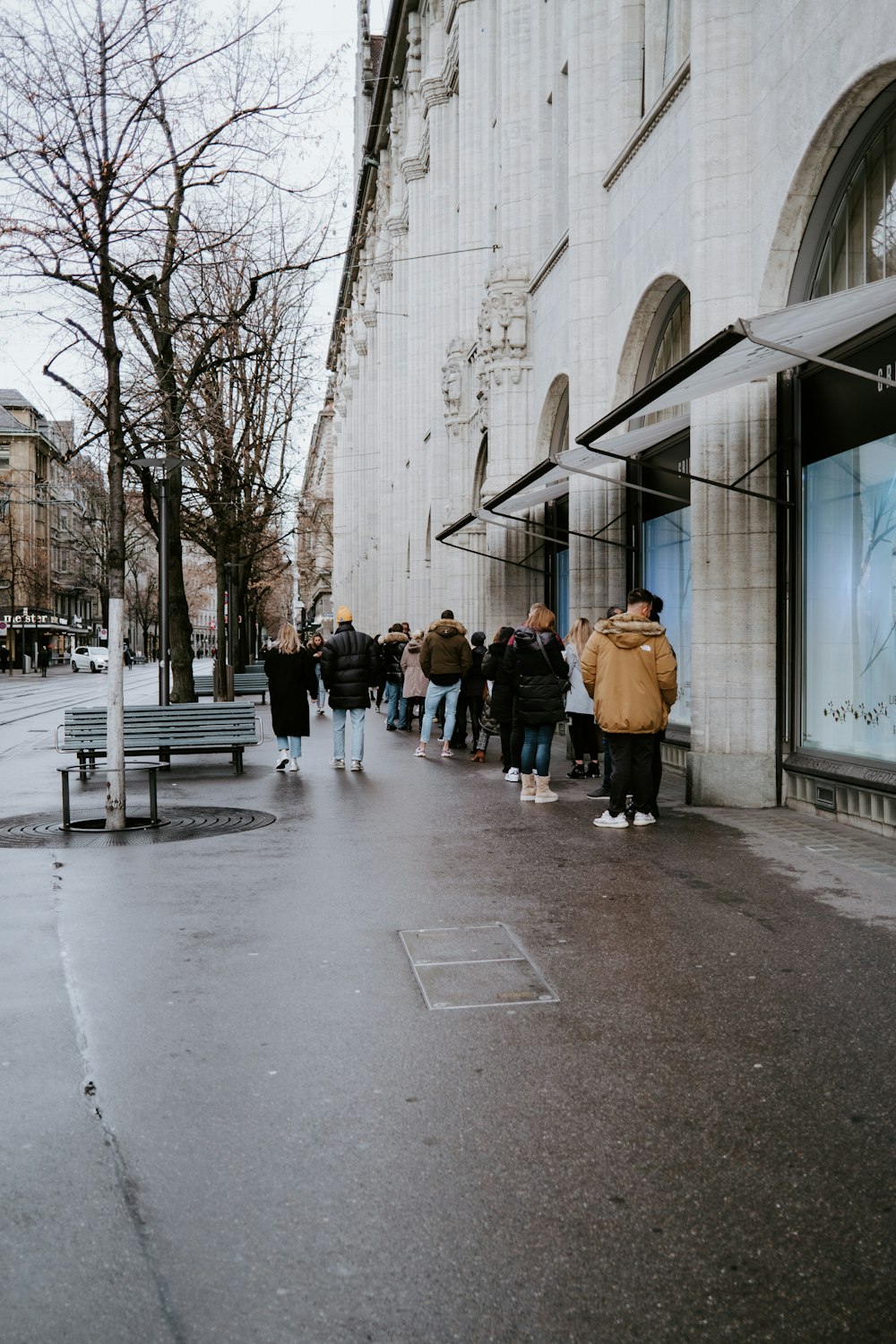 people walking on sidewalk during daytime