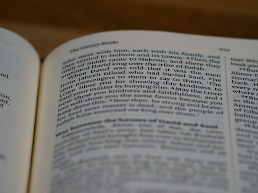 A close-up view of an open book, focusing on a page with text discussing historical themes. The text is written in a clear, serif font, and the page number 327 is visible.