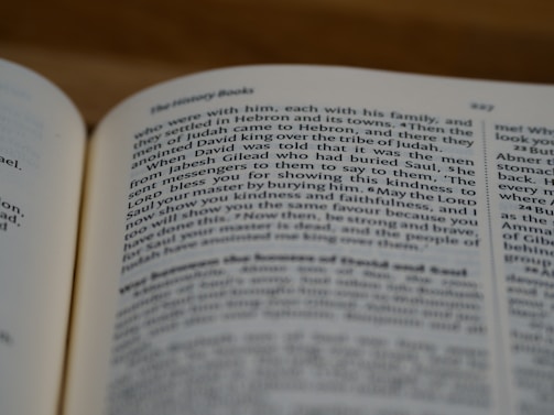 A close-up view of an open book, focusing on a page with text discussing historical themes. The text is written in a clear, serif font, and the page number 327 is visible.