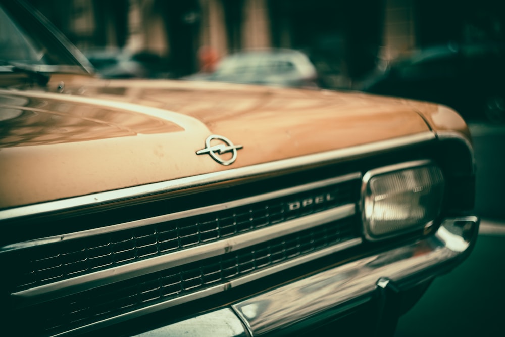 brown mercedes benz car in tilt shift lens