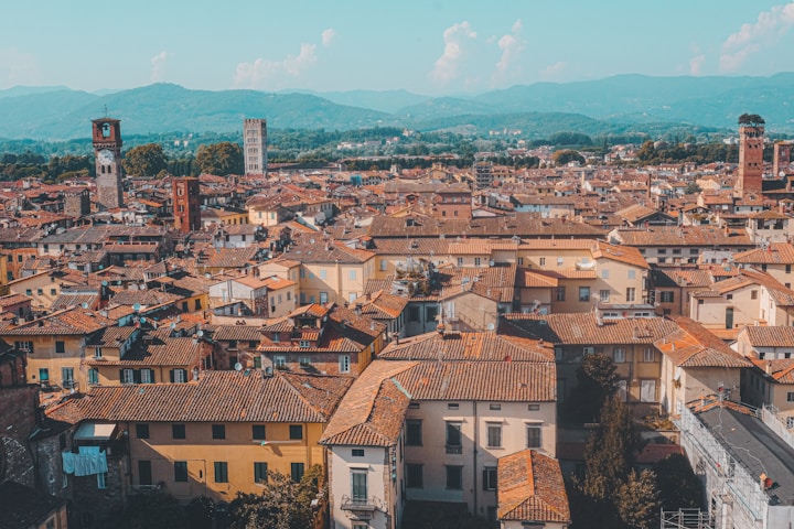 The medieval city walls and towers of Lucca, Tuscany, Italy.