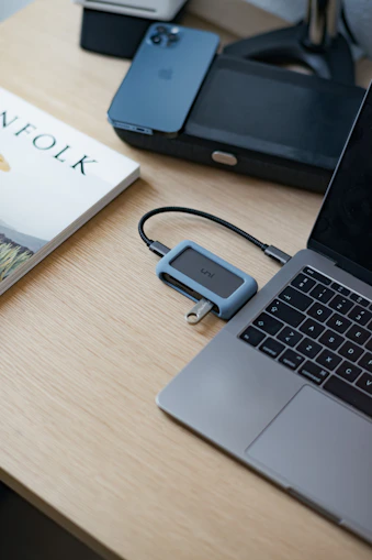 A sleek, minimalist office space with legal books and a laptop on a polished desk.