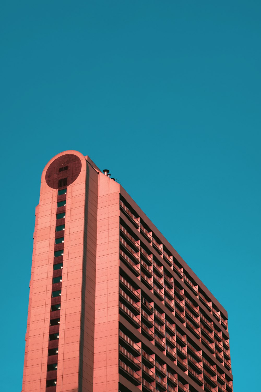 brown concrete building under blue sky during daytime