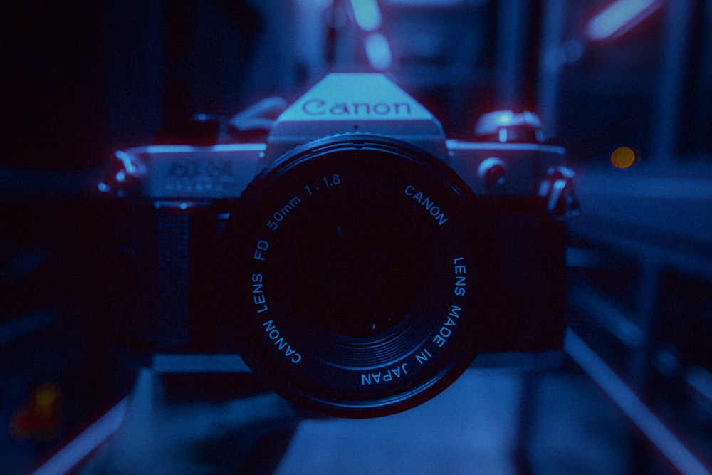 black nikon dslr camera on table