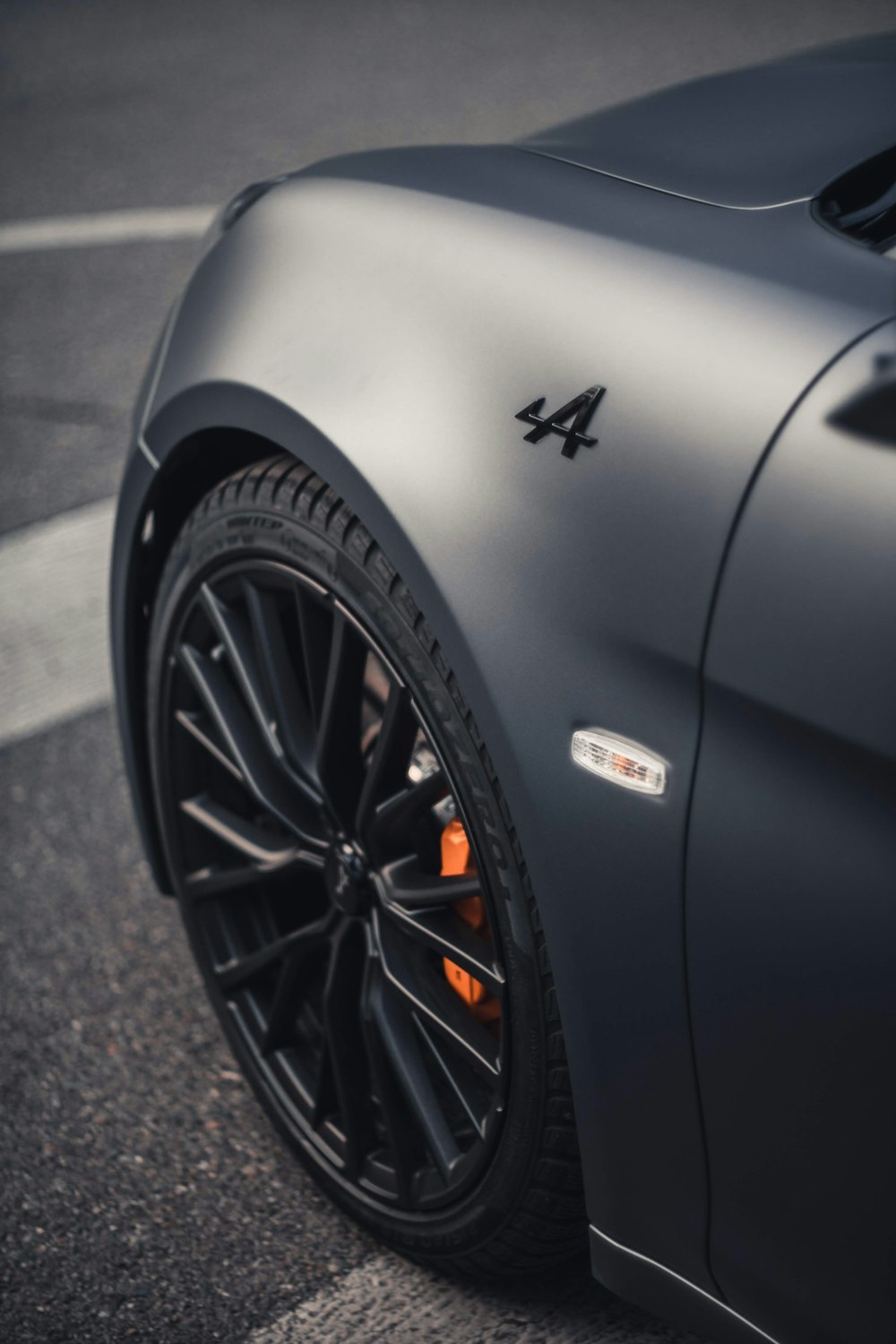 black car on gray asphalt road during daytime