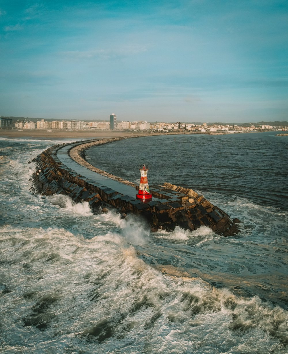 sea waves crashing on shore during daytime