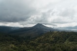 green mountain under white clouds during daytime