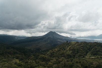 green mountain under white clouds during daytime