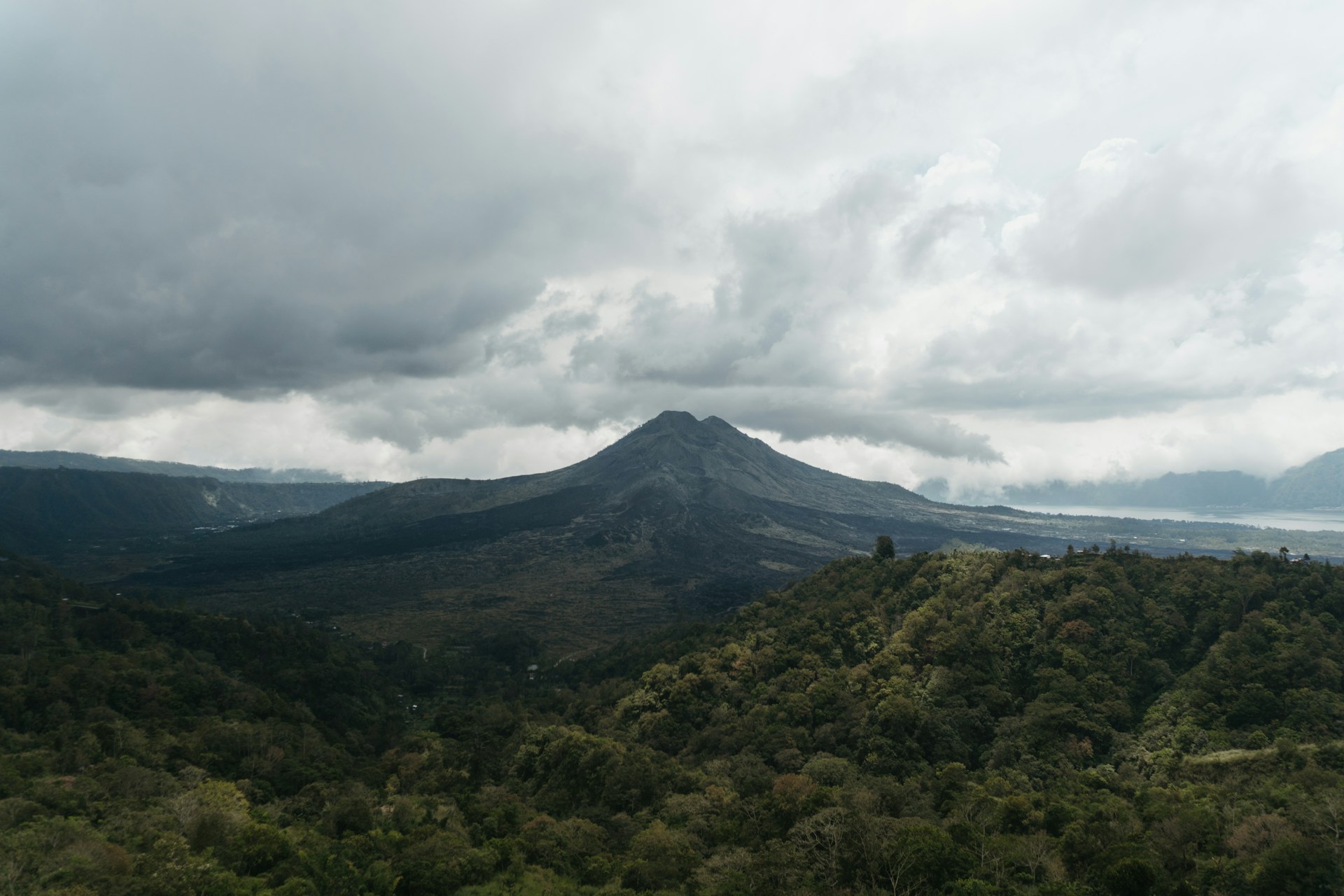 green mountain under white clouds during daytime