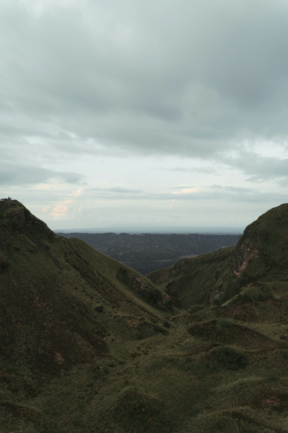 green mountains under white clouds during daytime