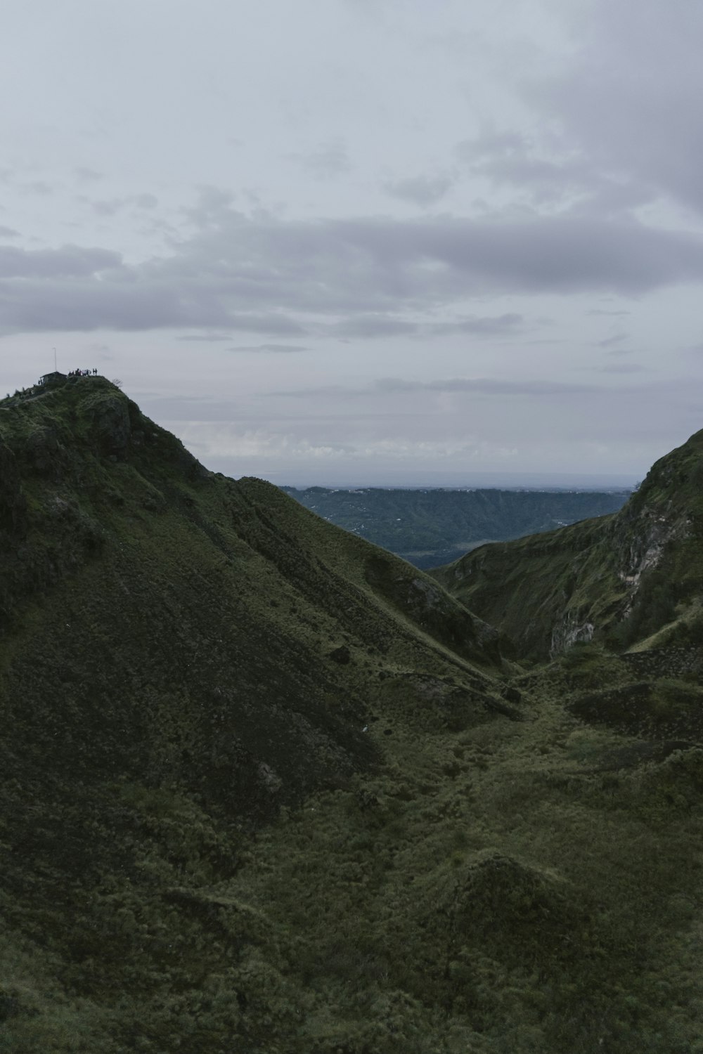 green mountain under white clouds during daytime