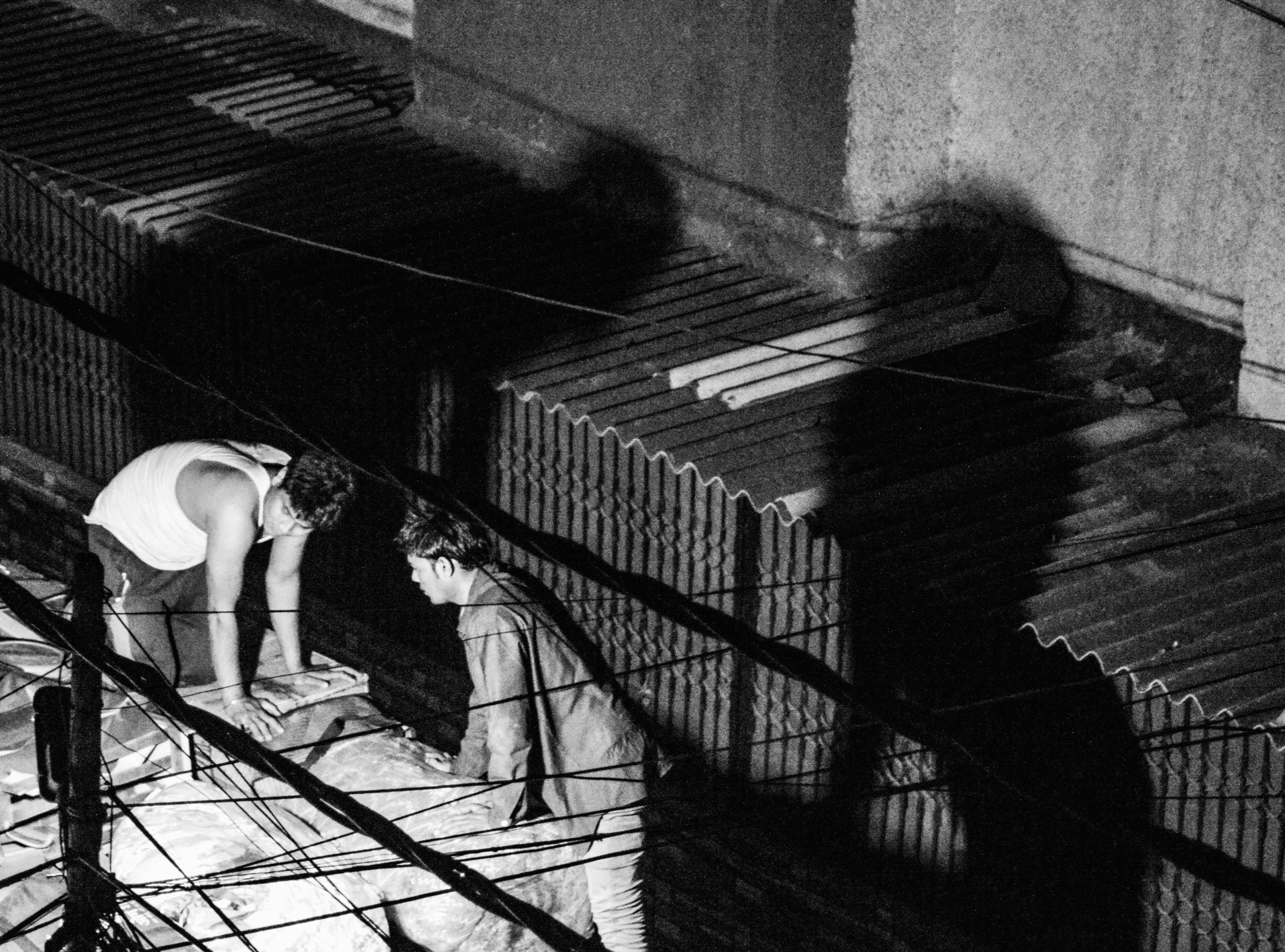 woman in white tank top and white shorts walking on stairs (Photo by Swarnavo Chakrabarti on Unsplash)