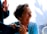 smiling woman in blue long sleeve shirt holding mans hand