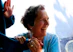 smiling woman in blue long sleeve shirt holding mans hand