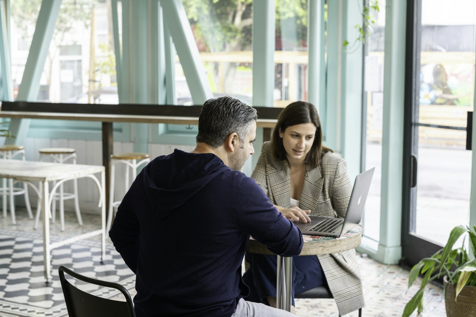 Two people in a seated advisory conversation