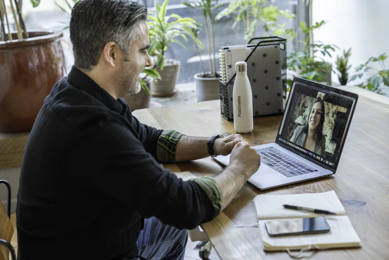 A man on a video call at a desk