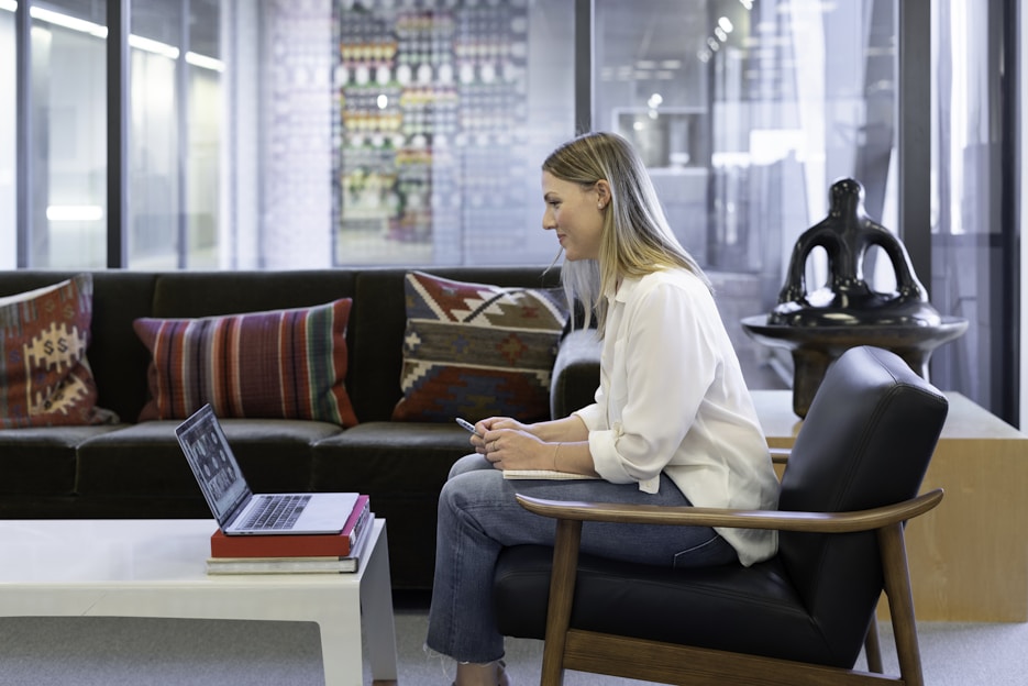 A professional lawyer using a laptop in a modern office