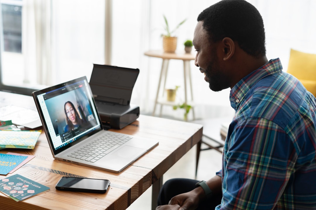 A salesperson working in an office on a virtual call