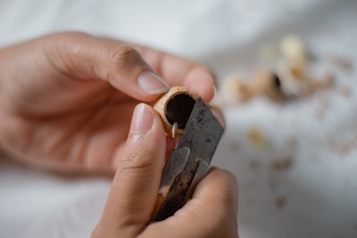 person holding black and silver steel tool