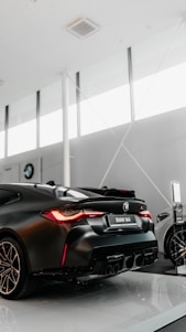 black porsche 911 parked in a parking lot