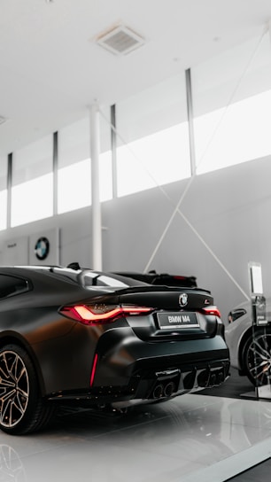 black porsche 911 parked in a parking lot