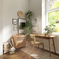 A serene corner of a home office showcasing a handcrafted desk paired with a comfortable chair bathed in natural light.