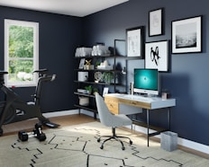 black flat screen computer monitor on brown wooden desk