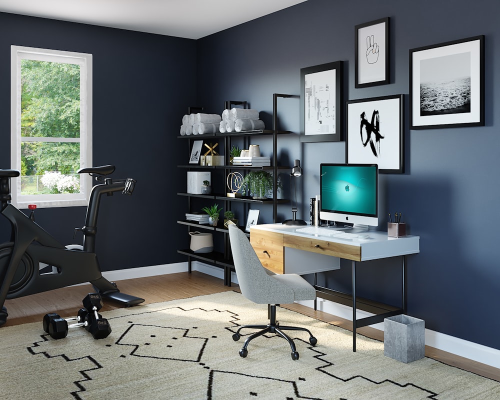 black flat screen computer monitor on brown wooden desk