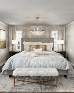 A cozy bedroom featuring luxurious bedding from billion llc.