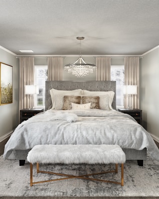 A cozy bedroom featuring luxurious furnishings.